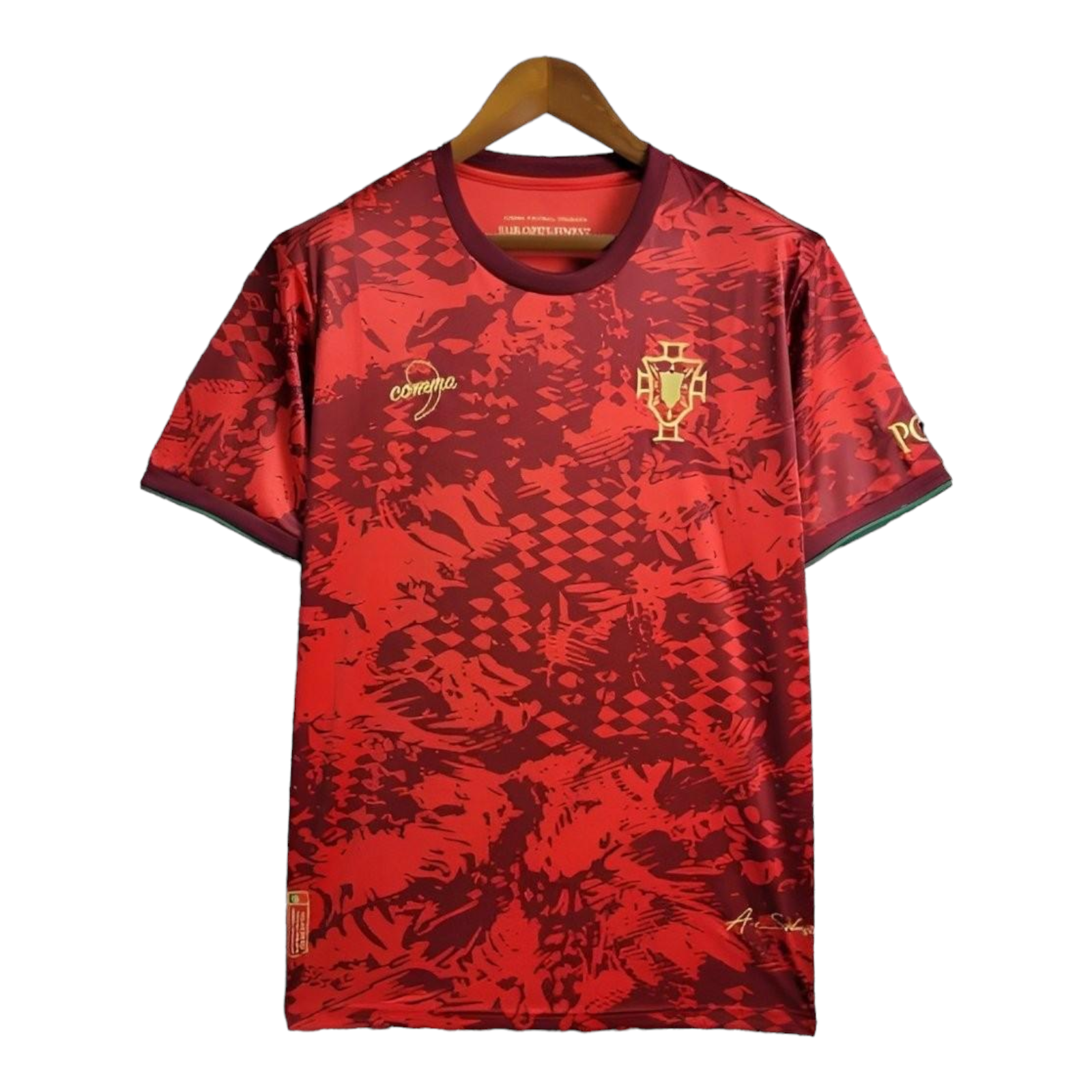 Photoroom-20240614-195047 Red Portugal soccer jersey on a wooden hanger with gold crest on the left chest and abstract red pattern throughout.