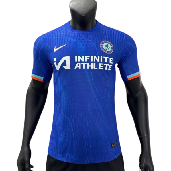 Blue Chelsea FC football jersey on a mannequin, displaying the 'Infinite Athlete' sponsor and club crest on the chest.