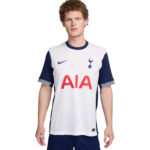 Young man wearing a white Tottenham Hotspur football jersey with navy sleeves, Nike swoosh, and AIA sponsor.