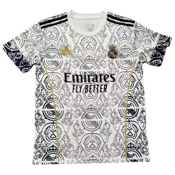 White Real Madrid soccer jersey with an ornate monochrome crest pattern, featuring the Real Madrid crest, Adidas logo, and Emirates Fly Better sponsor text.