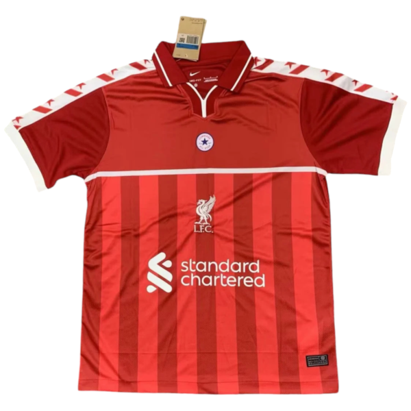 Red Liverpool FC home jersey with vertical stripes and white sponsor text 'Standard Chartered' on front.