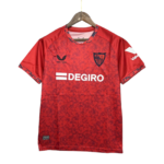 Red patterned soccer jersey hanging on a wooden hanger, displaying a club crest on the left chest and the 'DEGIRO' sponsor across the front.