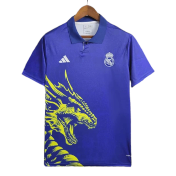 Blue polo shirt on a hanger with a Real Madrid crest on the chest and a bright yellow dragon print across the front