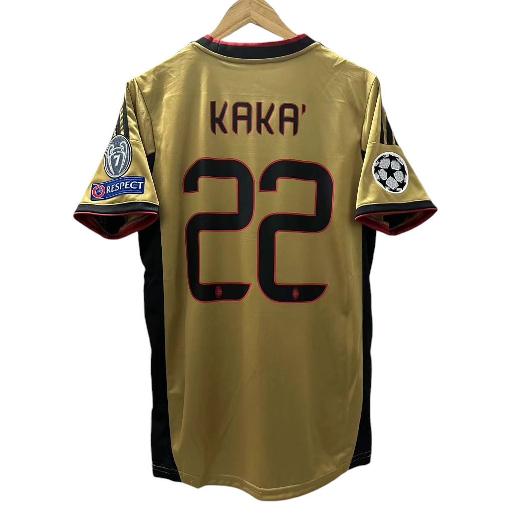 Photoroom-20240806-055427 Golden soccer jersey on hanger with name KAKA' and number 22, featuring UEFA Champions League patch and RESPECT patch on sleeves.