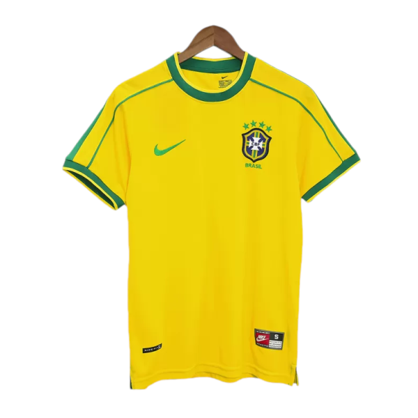 Yellow Brazil national football jersey on a hanger with green trim and crest (CBF) on the chest.