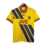 Yellow Arsenal football jersey with blue diagonal stripes, JVC sponsor, Adidas logo, hanging on a hanger.