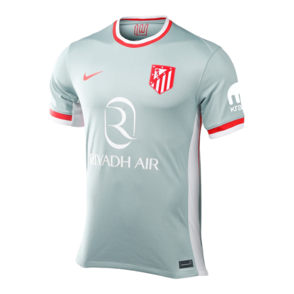 Light blue soccer jersey with red trim and white side panels, featuring the Atlético Madrid crest and Riyadh Air sponsor logo on the front.