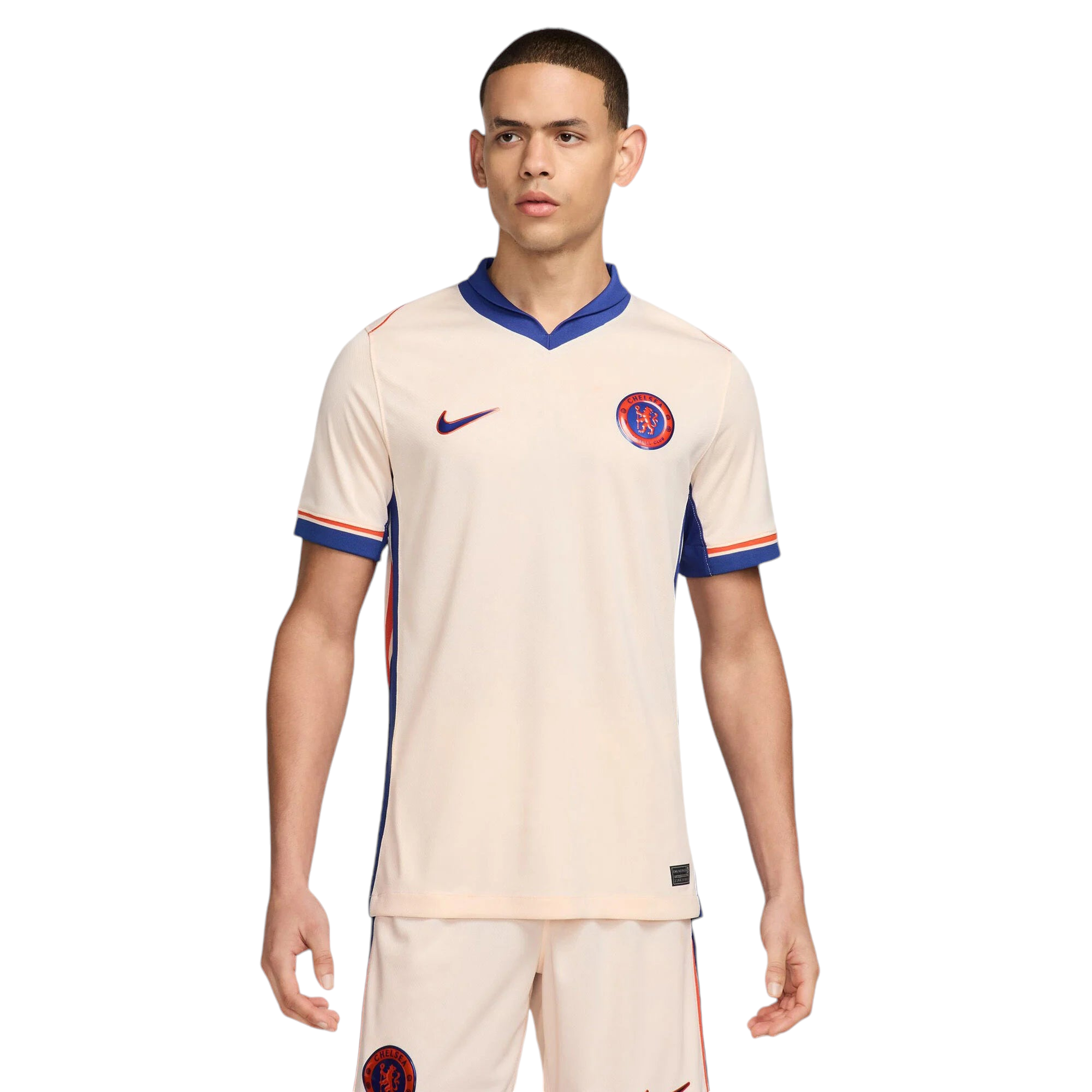 Photoroom-20240815-063956 Young man wearing a Chelsea FC cream soccer jersey with blue collar, standing against a white background, crest visible on chest.