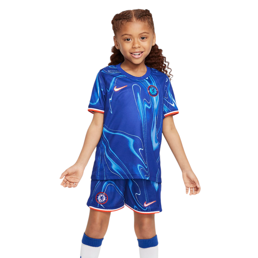 Photoroom-20240815-074904 Smiling young girl in a Chelsea FC blue soccer jersey and shorts with white socks and orange trim.