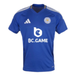 Front view of a blue Leicester City football jersey with white Adidas stripes on the shoulders and a white BC.GAME sponsor logo across the chest.