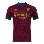 Maroon football jersey with blue collar, gold sponsor text 'TOUR' across chest and team crest on the left chest