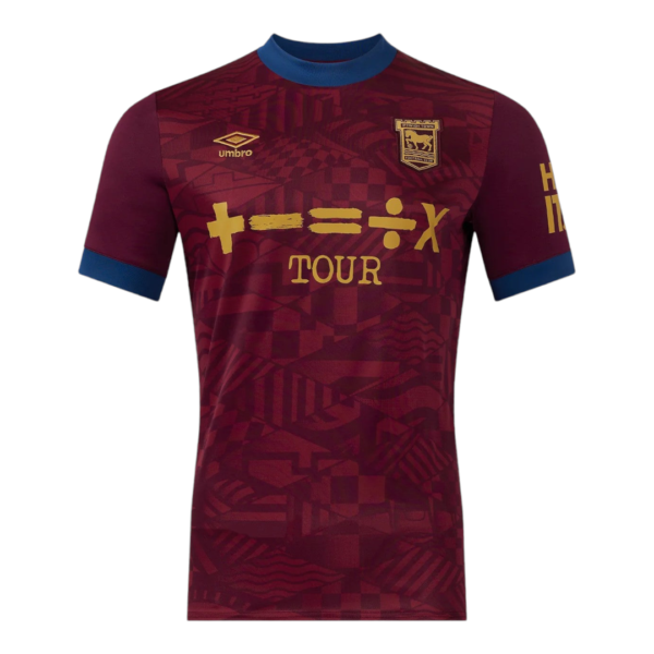 Maroon football jersey with blue collar, gold sponsor text 'TOUR' across chest and team crest on the left chest