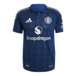 Manchester United dark blue away jersey featuring the Snapdragon sponsor and club crest.