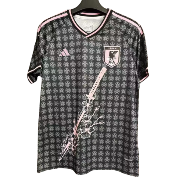 Japan national football team jersey with pink trim and floral sword graphic on the front