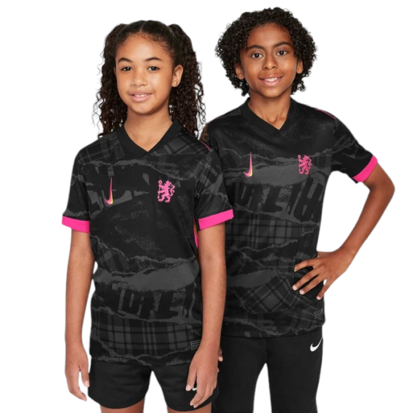 Two young girls stand together wearing matching black sports jerseys with pink cuffs and Nike swoosh logos.
