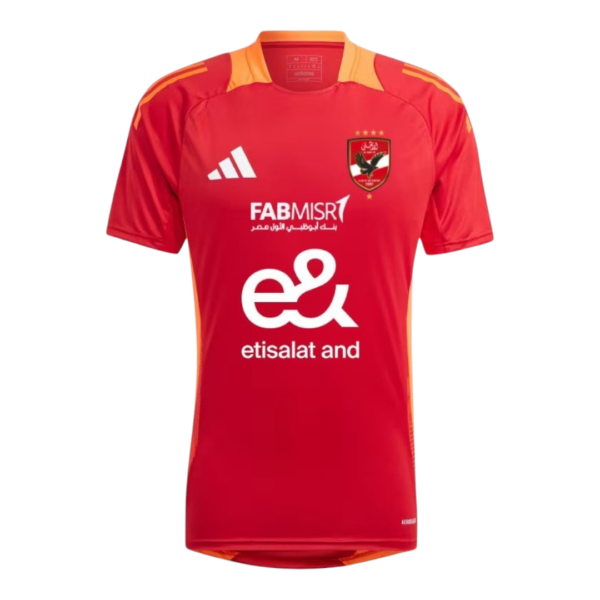 Red soccer jersey with orange shoulder accents, Adidas logo left chest, club crest right chest, and large white Etisalat sponsor text across front.