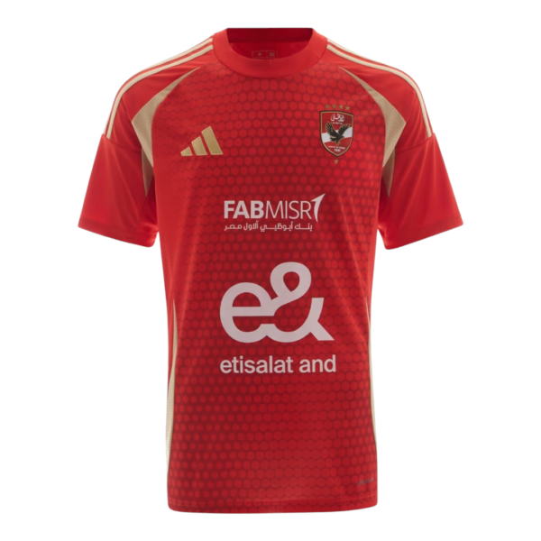 Red soccer jersey with honeycomb pattern, beige side panels, and crest on the chest featuring Etisalat sponsor text.