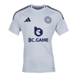 Light blue soccer jersey with dark blue Adidas stripes on shoulders, team crest on left chest, and a large BC.GAME sponsor logo centered on the front.