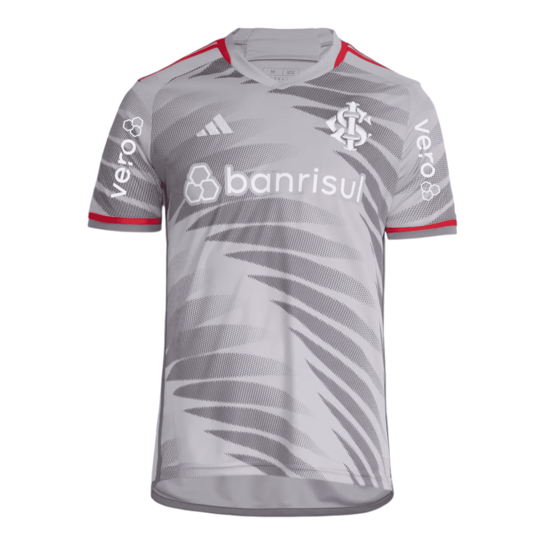 Photoroom-20241103-180258 | UAE SPORT STORE Front view of a gray soccer jersey with an abstract diagonal pattern, white 'banrisul' sponsor across the chest, club crest on the left chest, and Adidas logo; red trim on sleeves.
