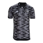 Black and gray zigzag-patterned short-sleeve soccer jersey with a V-neck collar and white logos on the chest (Adidas and circular emblem).