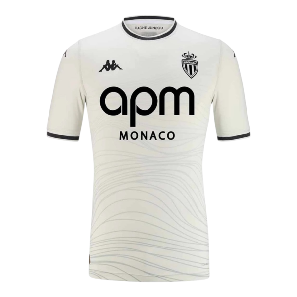 White AS Monaco football jersey with black 'apm MONACO' sponsor logo and club crest on chest, front view of shirt.