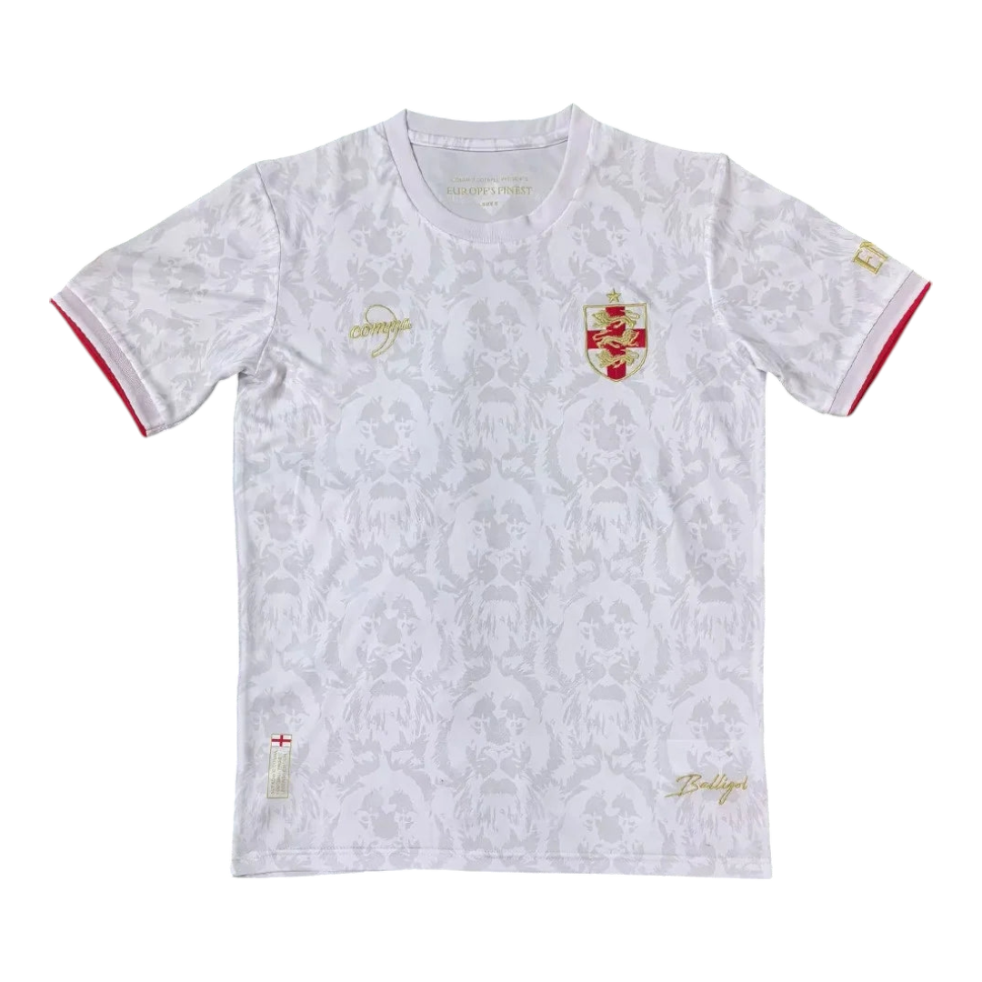 Photoroom-20241226-040012 White T-shirt with a subtle grey floral/coat pattern, gold crest on the left chest and gold script details, red-trimmed sleeve cuffs.