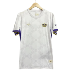 White soccer jersey on a hanger with purple and gold trim and a crown crest on the left chest