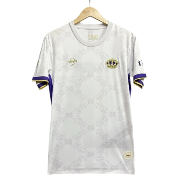 White soccer jersey on a hanger with purple and gold trim and a crown crest on the left chest