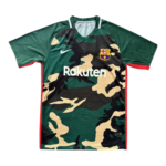 Camouflage FC Barcelona football jersey with Rakuten sponsor and team crest on the chest.