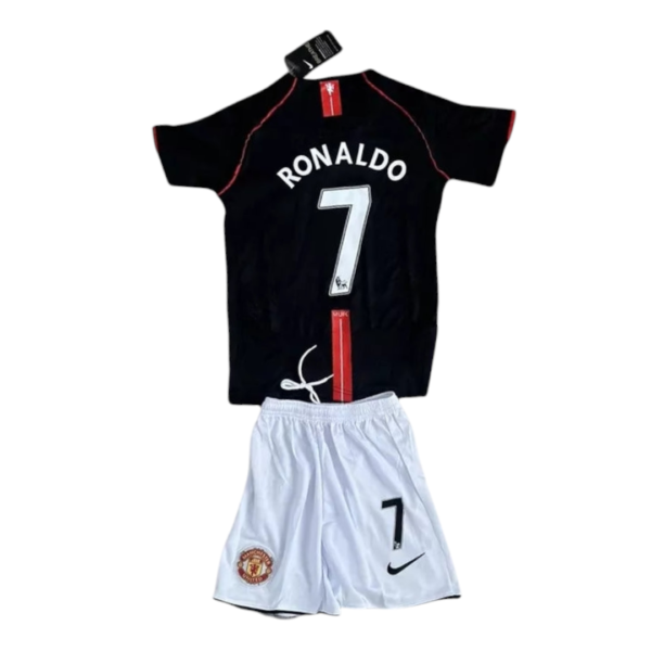 Black Ronaldo jersey with white 'RONALDO' and large number 7, red piping, worn with white Manchester United shorts.