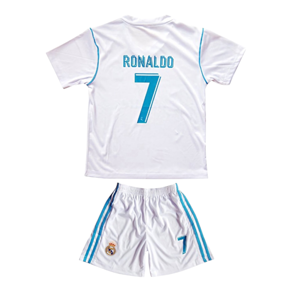 Back view of a white Real Madrid soccer jersey with blue trim and a large turquoise number 7 on the back.