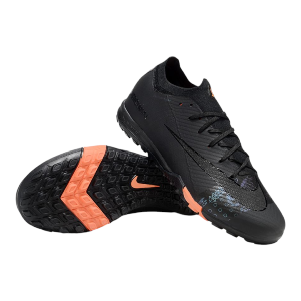 Pair of black athletic shoes with orange accents and textured upper, shown from a side angle with one shoe resting on the sole.