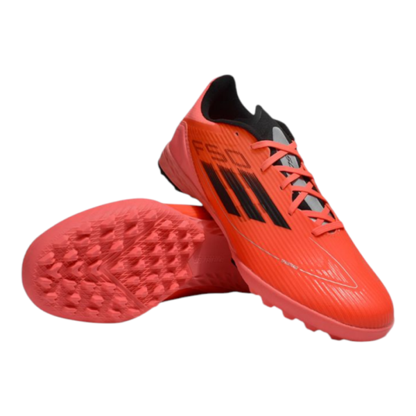 Bright orange soccer cleats with black side stripes and studded soles, lace-up