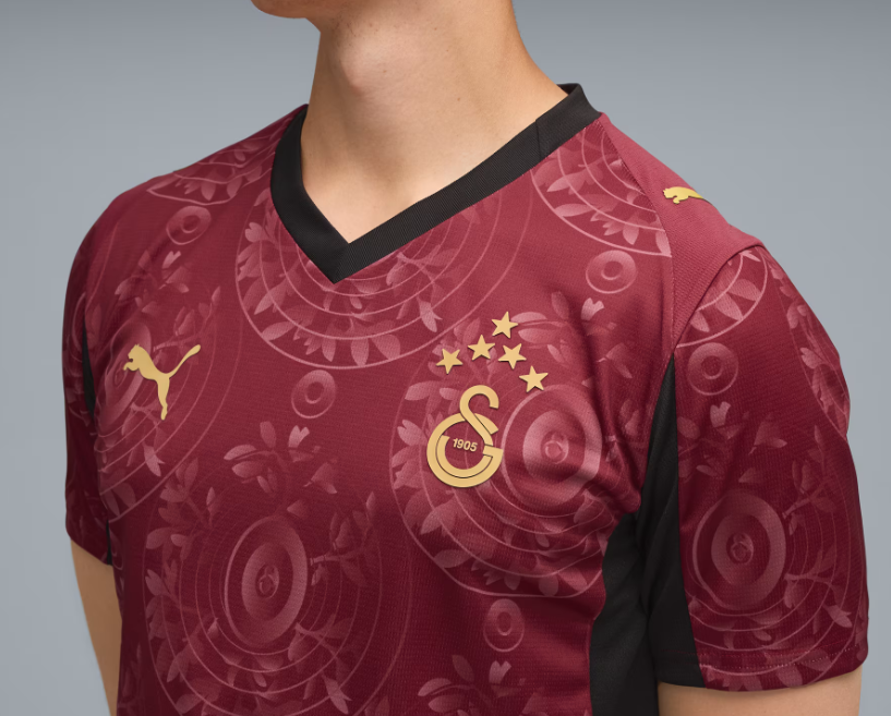 Q2 | UAE SPORT STORE Maroon Galatasaray football jersey with black V-neck, Puma logo, and crest with five gold stars on the chest.