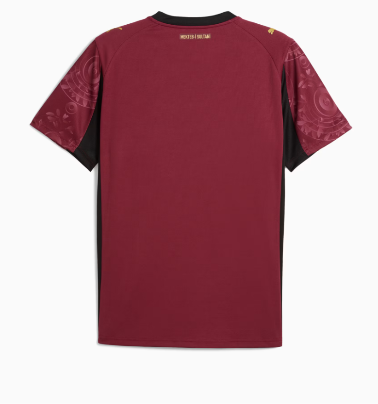 Q6 | UAE SPORT STORE Back view of a maroon athletic jersey with black side panels and patterned sleeves; small gold text near the collar reads 'MEKTEB I SULTANI'.
