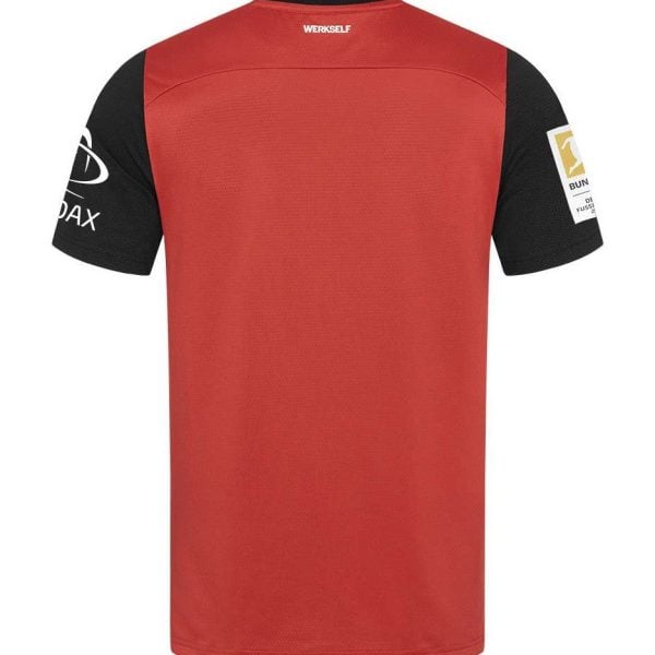Back view of red athletic jersey with black sleeves and sponsor logos on both sleeves.