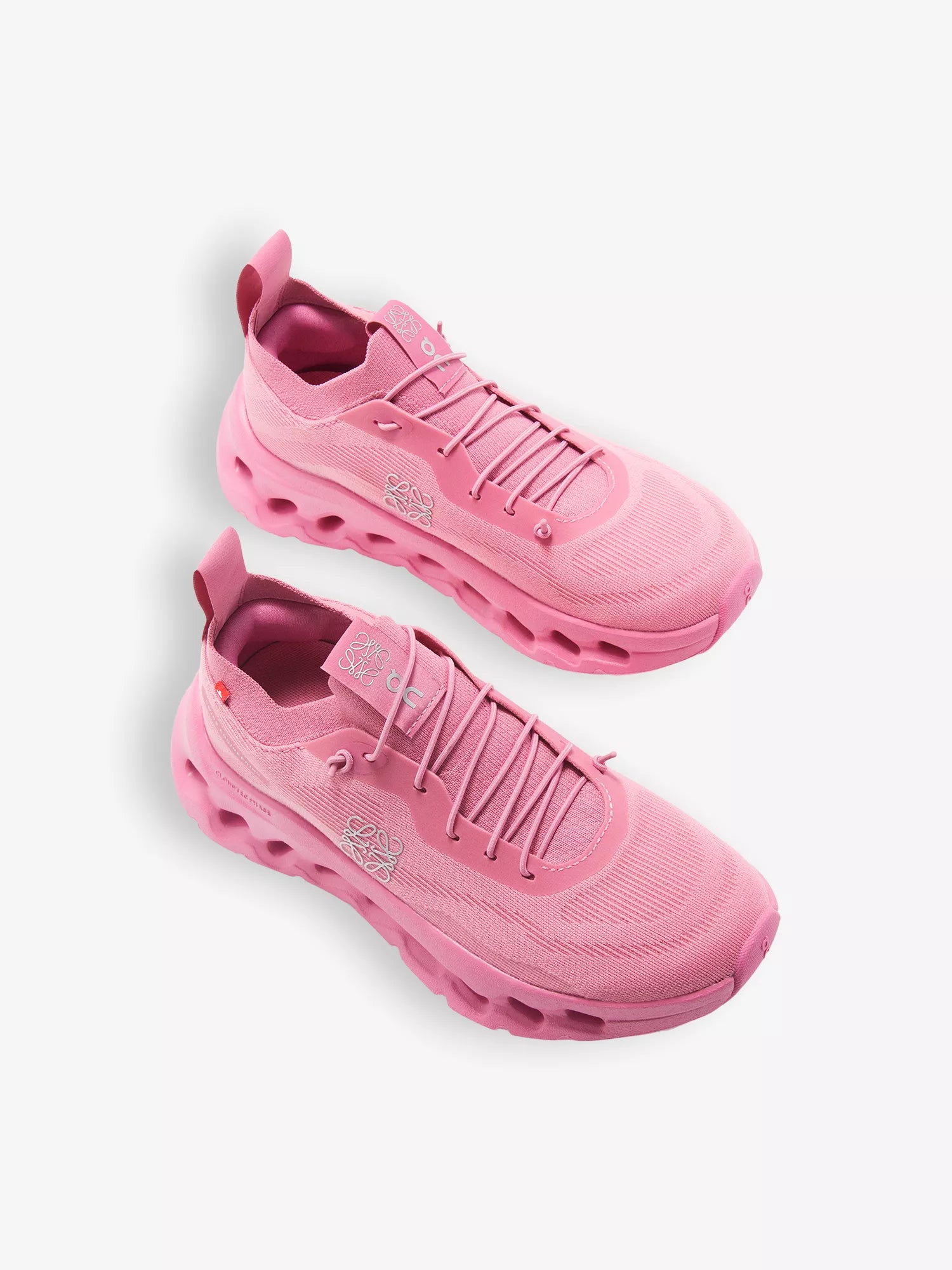 R04336355_WILDROSE_ALT02 Pair of pink athletic sneakers with rounded chunky soles on a white background