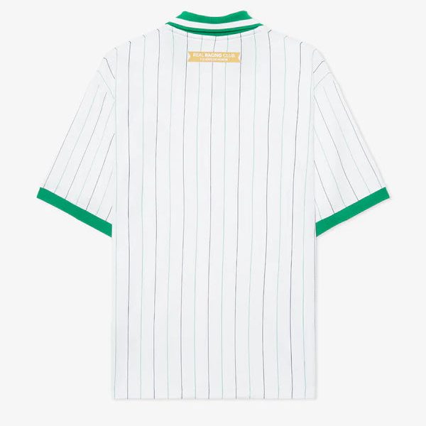 Back view of a white polo shirt with thin green vertical pinstripes, green collar, and green sleeve cuffs.