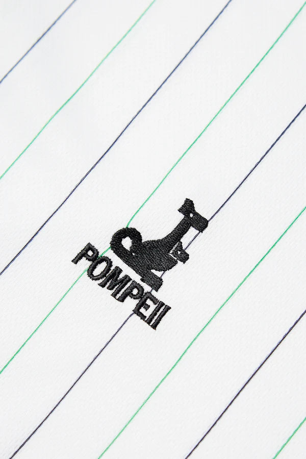 RACINGSHORTSLEEVE_05copia_600x_73756634-2a53-4316-964a-23e8be952999 | UAE SPORT STORE Embroidered sewing machine logo with the word POMPEI on white fabric with diagonal blue and green stripes.