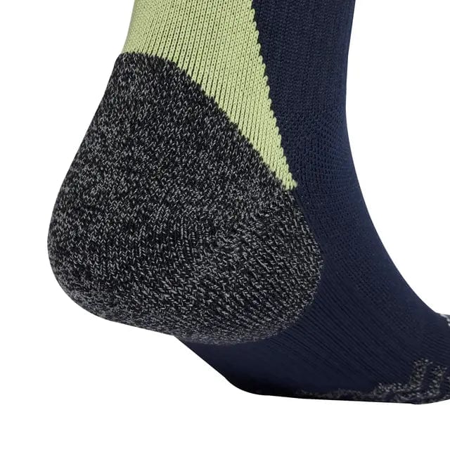 RMCFMF0187_3 | UAE SPORT STORE Close-up of a color-blocked sock: gray reinforced heel, lime-green cuff, and navy foot section.