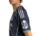 Side view of a dark blue soccer jersey with HP logo on the sleeve and sponsor branding visible
