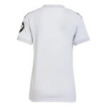 White short-sleeve sports jersey viewed from the back, with black shoulder seams and a circular logo on the left sleeve.