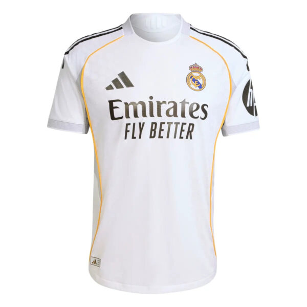 White Real Madrid football jersey with Emirates Fly Better sponsor and yellow piping along seams.