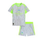Grey Manchester City away jersey with neon lime accents, water‑droplet pattern, Etihad Airways sponsor, and Puma logo