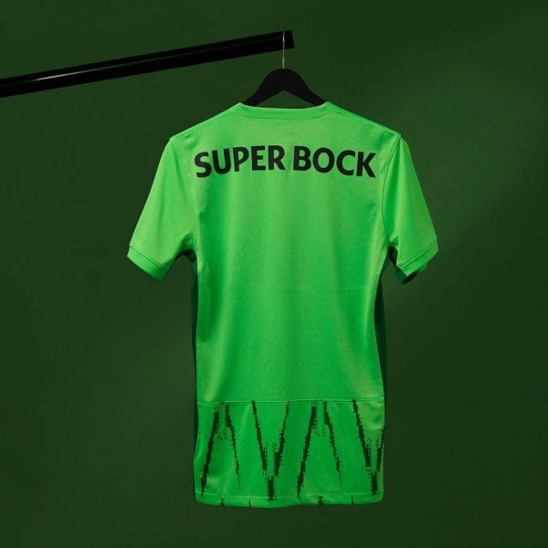 Bright green short-sleeve sports jersey hanging on a black hanger against a matching green background; the back shows the bold text 'SUPER BOCK'.