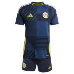 Scotland national team training jersey and shorts set in dark blue with geometric patches and neon yellow accents, crest on chest and matching shorts.