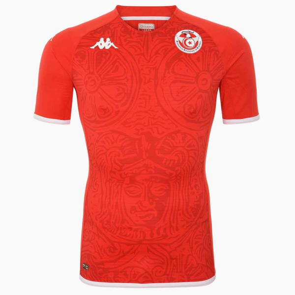 Red soccer jersey with white-trim sleeves and a circular team crest on the left chest, featuring a stylized emblem.