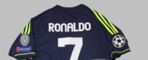 Back of a dark blue Ronaldo jersey with number 7; Champions League and Respect patches on the sleeves.