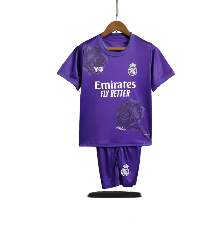 Screenshot2024-05-22195819 Purple Real Madrid football kit (jersey and shorts) hanging on a wooden hanger, featuring the Emirates Fly Better sponsor and club crest.