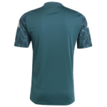 Screenshot2024-08-11234505 | UAE SPORT STORE Teal sports jersey shown from the back with patterned dark sleeves and a curved hem.